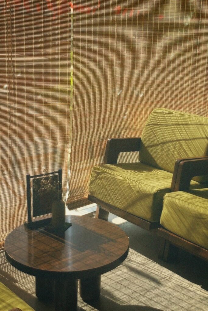 A sunlit vintage living room with retro furniture and striped patterns. Perfect for cozy vibes.